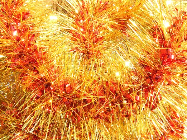 Background of red and orange Christmas garland — Stock Photo, Image
