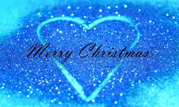 Metinle Merry Christmas mavi glitter bulanık soyut kalp tebrik kartı — Stok fotoğraf