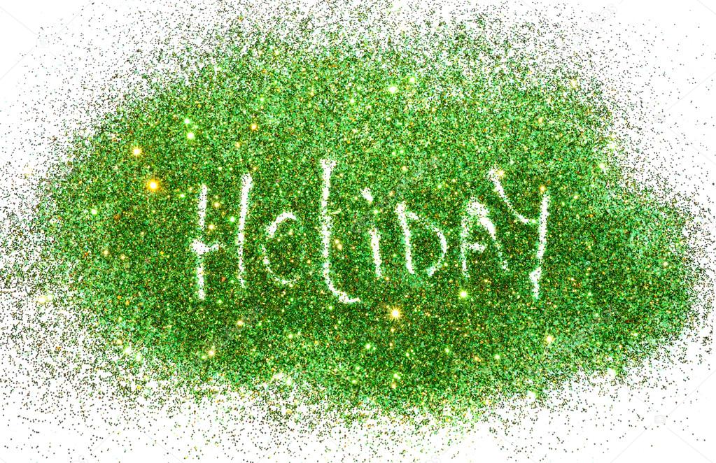 Word Holiday on green and golden glitter sparkles on white background