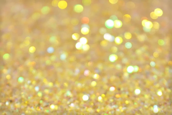 Defocused golden bokeh light, holiday background — Stock fotografie