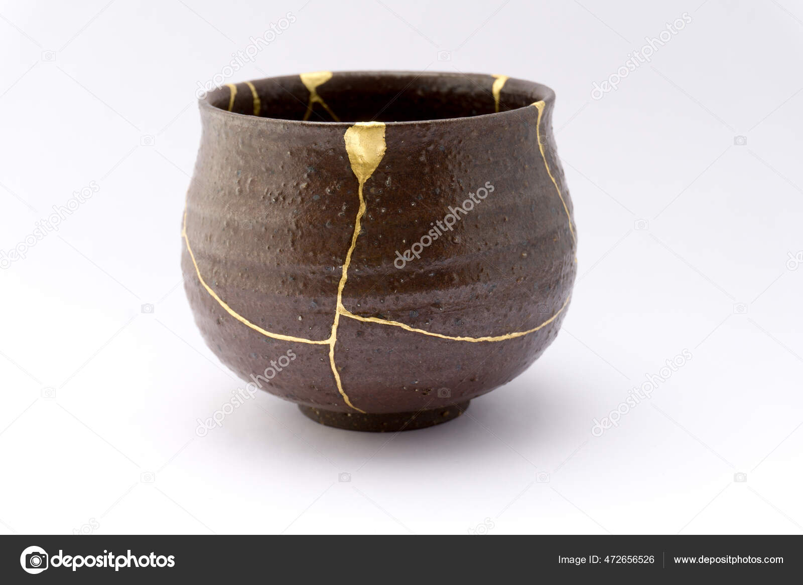 Antique Japanese ceramic kintsugi bowl restored with gold. Antique