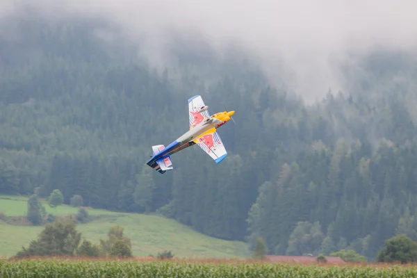 Model aircraft of RedBull in aerobatics — Stock Photo, Image