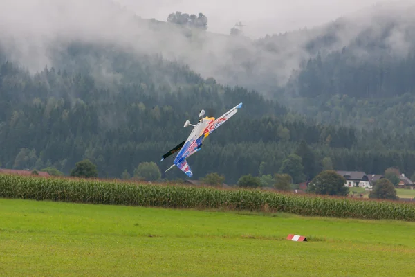 Model aircraft of RedBull in aerobatics — Stock Photo, Image