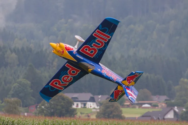 Model aircraft of RedBull in aerobatics — Stock Photo, Image