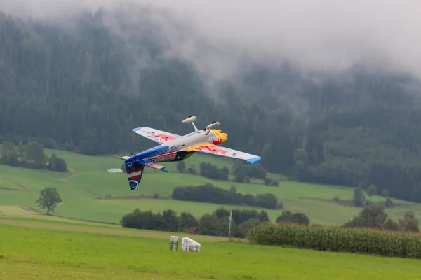 Model aircraft of RedBull in aerobatics Royalty Free Stock Images