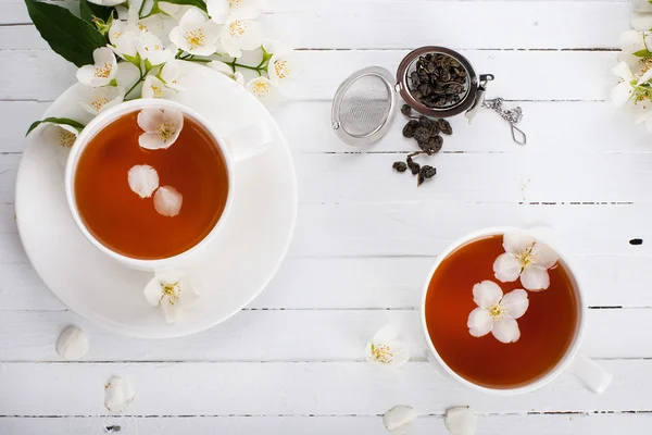 Conceived with a cup of tea on a white surface — Stock Photo, Image