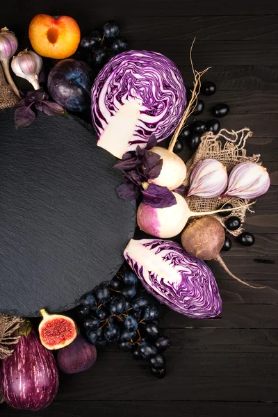 Purple vegetables on a wooden background — Stock Photo, Image