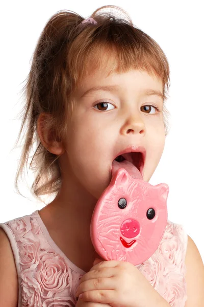 Funny child with a lollipop on an isolated background — Stock Photo, Image