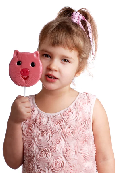 Funny child with a lollipop on an isolated background — Stock Photo, Image