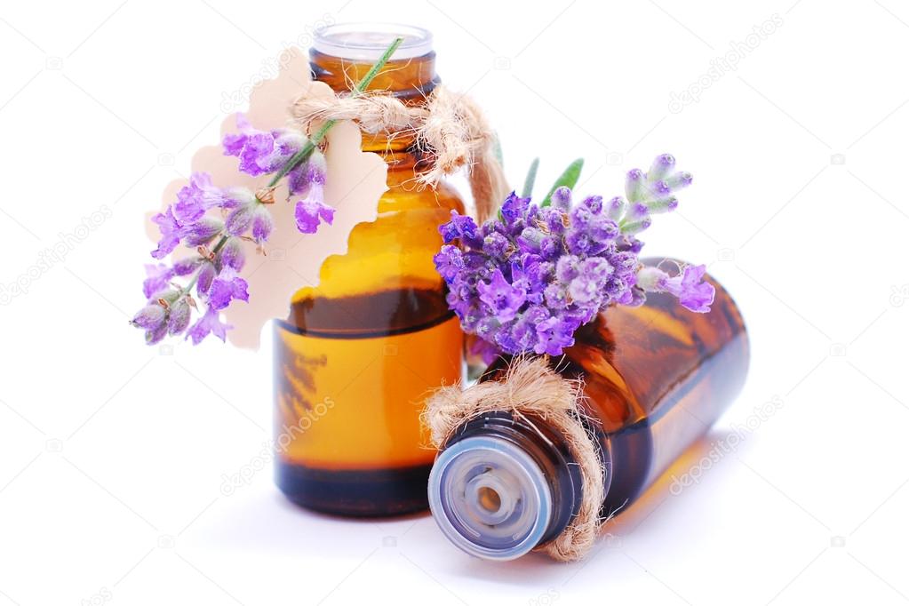 Bottle with lavender oil isolated on white background