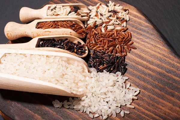 Different types of rice and spices — Stock Photo, Image