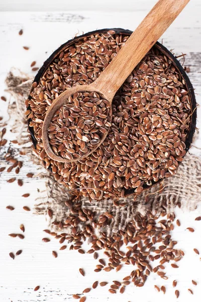 Linseed, flax seeds on sackcloth — Stock Photo, Image