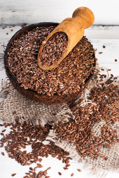 Linseed, flax seeds on sackcloth — Stock Photo, Image