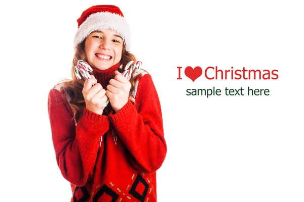 Portrait of a girl in christmas clothes with a gift in hand on isolated white background — Stock Photo, Image