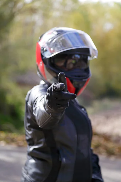 Biker Girl Pointing His Finger You Soft Focus Background — Stock Photo, Image