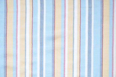 Yakın plan mavi, açık kahverengi ve beyaz çizgili kumaş.