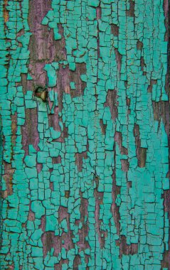 Eski ahşap dokusu soyulmuş boyayla kaplı..