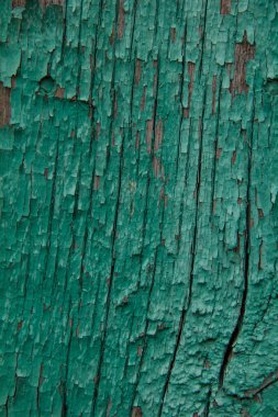 Eski ahşap dokusu soyulmuş boyayla kaplı..