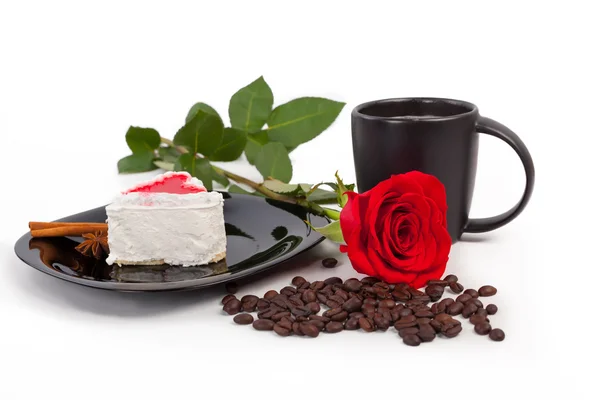 cup of coffee with cake and rose