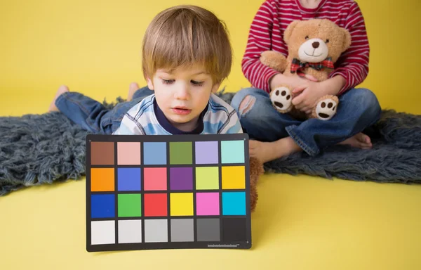 Child Holding Photography Color Checker Card — Stock Photo, Image