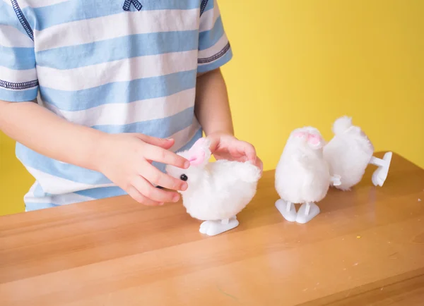 Child playing with Easter Bunny Toys — Stock Photo, Image