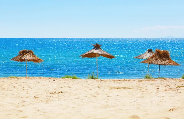 Straw beach umbrellas — Stock Photo, Image