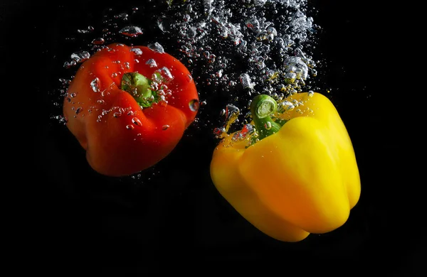 Fresh paprika in water — Stock Photo, Image