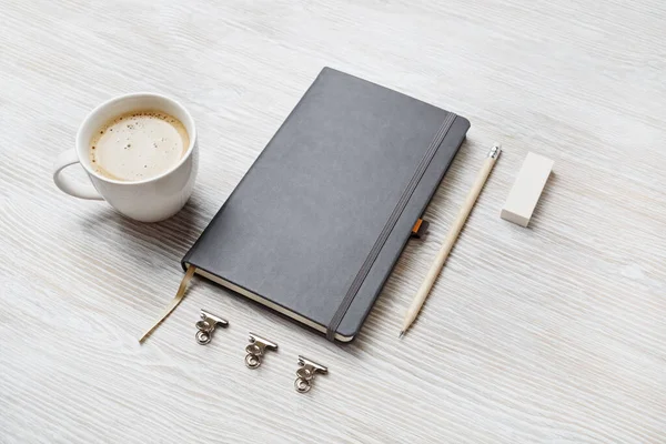 Photo Blank Sketchbookk Pencil Eraser Coffee Cup Light Wood Table — Stock Photo, Image