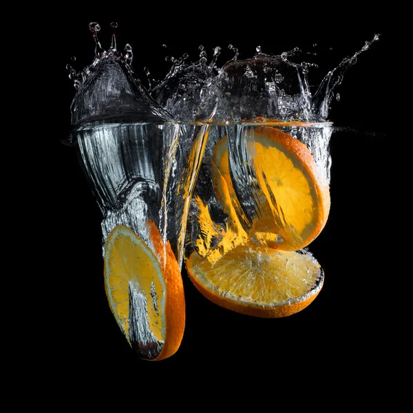 Orange slices in water — Stock Photo, Image