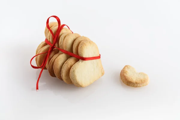 Cookies hearts with red ribbon — Stock Photo, Image