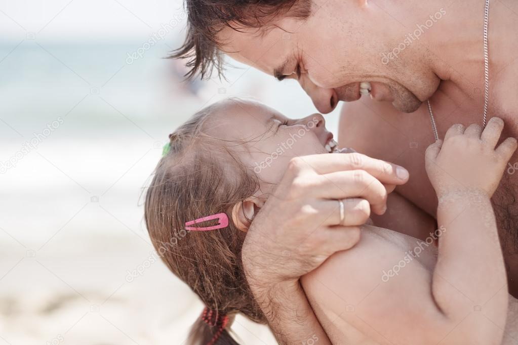 Dad and daughter laughing