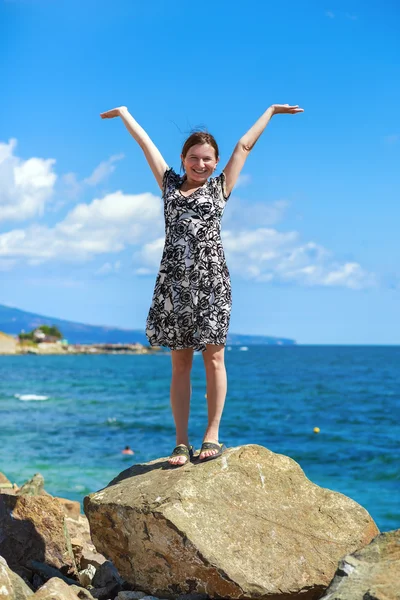 Woman with arms raised — Stock Photo, Image