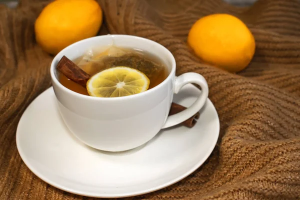 Close White Cup Tea Lemon Cinnamon Stands Warm Yellow Sweater — Stock Photo, Image