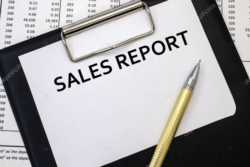 The sales report is written on a stationery tablet. Business documents. Business and financial concept