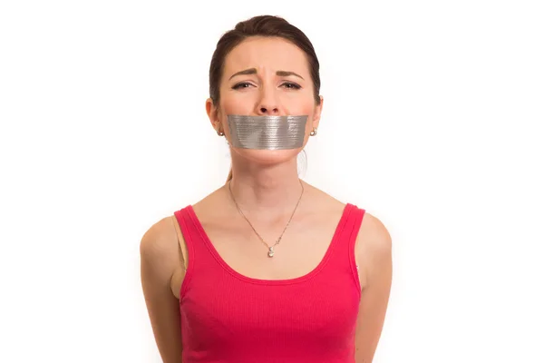 Woman in red with gaffer tape on her mouth experiencing emotional pain isolated — Stock Photo, Image