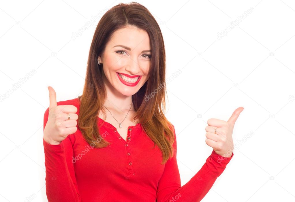 Cheerful sexy woman in red shows thumbs up with two hands
