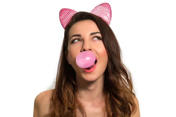 Cute playful girl blowing pink chewing bubble gum looking up on — Stock Photo, Image