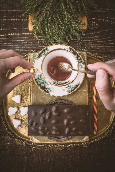 Drinking tea with chocolate vertical — Stock Photo, Image