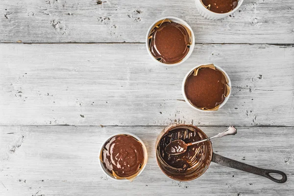 Chocolate dough for fondant in the ramekin horizontal — Stock Photo, Image