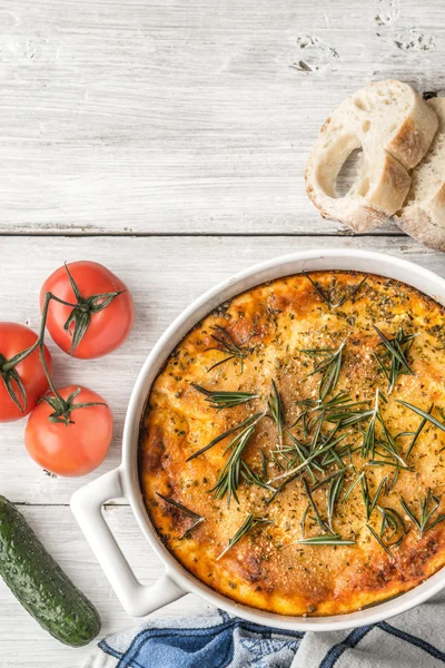 Moussaka in the white table with vegetable and bread vertical — Stock Photo, Image