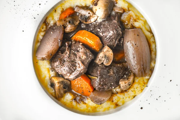 Beef bourguignon in a ceramic plate, carrot, shallot — Stock Photo, Image