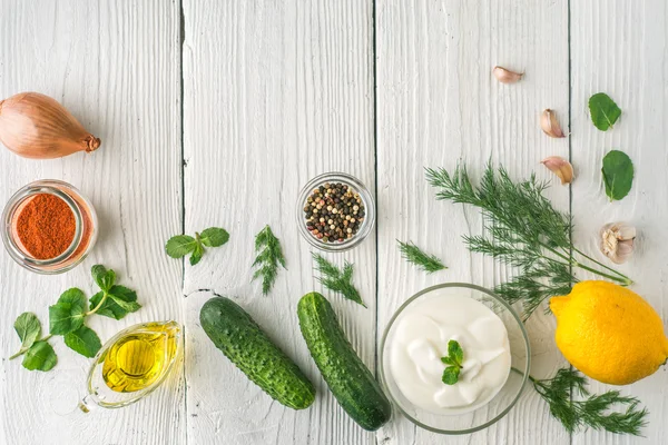 Ingredients for tzatziki on the white wooden table  top view — Stock Photo, Image