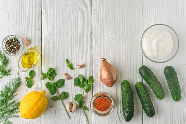 Ingredients for tzatziki on the white wooden table horizontal — Stock Photo, Image