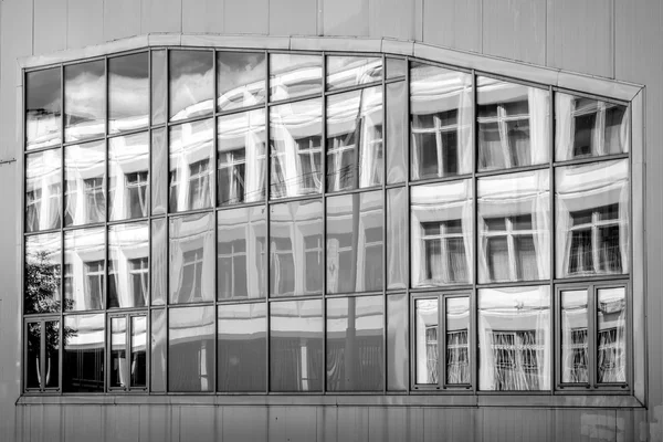 Window with building reflection black and white — Stock Photo, Image