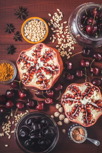 Different fruit and spices on the red wooden table. Concept of oriental fruits vertical — Stock Photo, Image