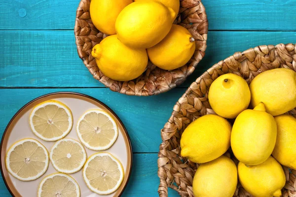 Lemons on the bright cyan background — Stock Photo, Image