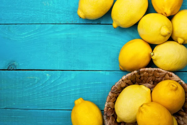 Lemons on the bright cyan background — Stock Photo, Image