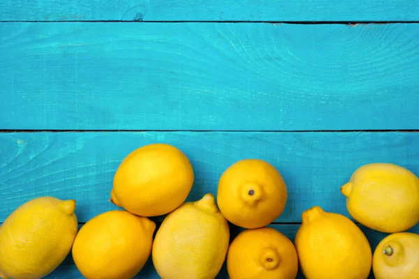 Lemons on the bright cyan background — Stock Photo, Image