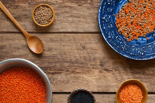 Different dishes with a lentil on a wooden table — Stock Photo, Image