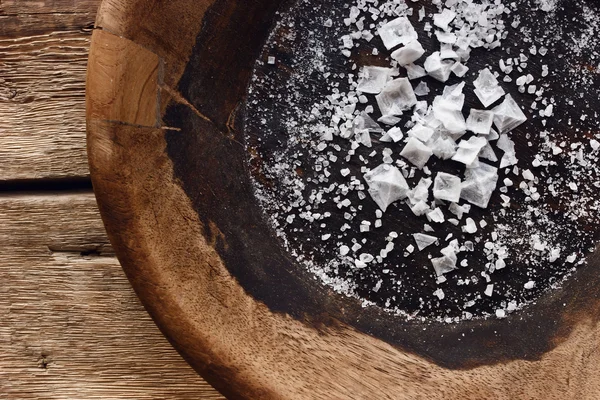 Various sea salt on the vintage wooden plate — Stock Photo, Image